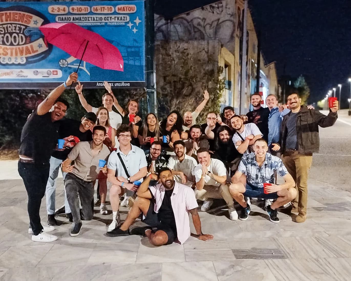 Group of international international friends enjoying multicultural party group athens at Athens pub crawl in Athens