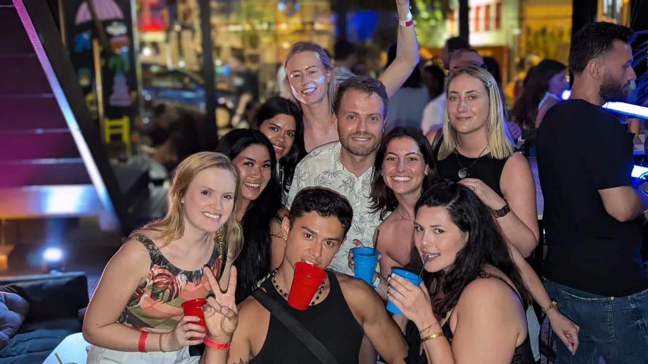 Diverse travelers from multiple countries celebrating during meet international friends athens nightlife bar crawl experience in Athens athens